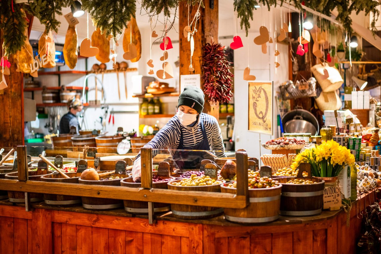 employee setting fresh food in the market